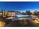 Stunning pool and spa at night, surrounded by desert landscaping at 11842 W Creosote Dr, Peoria, AZ 85383