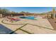 Stunning pool area with mountain views and lounge chairs at 11842 W Creosote Dr, Peoria, AZ 85383