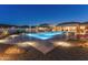 Expansive backyard pool with a spa and night lighting at 11842 W Creosote Dr, Peoria, AZ 85383