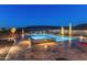 Luxury pool and spa with mountain views at night at 11842 W Creosote Dr, Peoria, AZ 85383