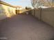 Large, gravel backyard area with block wall fencing at 12221 N 122 Dr, El Mirage, AZ 85335