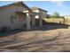 Large backyard with gravel covering and covered patio at 12221 N 122 Dr, El Mirage, AZ 85335