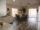 Dining area with glass table and chairs, adjacent to kitchen at 12221 N 122 Dr, El Mirage, AZ 85335