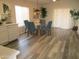 Bright dining area with glass top table and blue chairs at 12221 N 122 Dr, El Mirage, AZ 85335