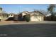 One-story house with attached garage and desert landscaping at 12221 N 122 Dr, El Mirage, AZ 85335