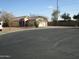 House exterior view, single-story home with driveway at 12221 N 122 Dr, El Mirage, AZ 85335