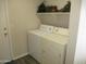 Laundry room with washer, dryer, and overhead shelving at 12221 N 122 Dr, El Mirage, AZ 85335