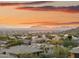 Stunning aerial view of a luxury community with mountain views at sunset at 13645 E Columbine Dr, Scottsdale, AZ 85259