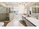 Spa-like bathroom with walk-in shower and double vanity at 13645 E Columbine Dr, Scottsdale, AZ 85259