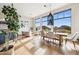 Bright dining room with large windows and a wooden dining table at 13645 E Columbine Dr, Scottsdale, AZ 85259