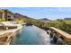 Relaxing pool area with a waterfall feature and lounge chairs at 13645 E Columbine Dr, Scottsdale, AZ 85259