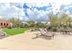 Community patio with lounge chairs and grassy lawn at 1536 W Blaylock Dr, Phoenix, AZ 85085