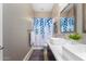 Bathroom with double vanity and a blue leaf shower curtain at 1536 W Blaylock Dr, Phoenix, AZ 85085