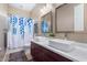 Bathroom with double vanity and a blue leaf shower curtain at 1536 W Blaylock Dr, Phoenix, AZ 85085