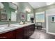 Modern bathroom with double vanity and a large mirror at 1536 W Blaylock Dr, Phoenix, AZ 85085