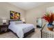 Charming bedroom with a full-size bed and artwork at 1536 W Blaylock Dr, Phoenix, AZ 85085