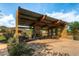 Covered patio area with fireplace and seating at 1536 W Blaylock Dr, Phoenix, AZ 85085