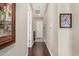 Long hallway with dark wood floors and artwork at 1536 W Blaylock Dr, Phoenix, AZ 85085