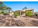 Home's backyard with a pergola and gravel landscaping at 15653 W Monterey Way, Goodyear, AZ 85395