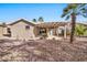 Backyard view showcasing a home with a pergola-covered patio at 15653 W Monterey Way, Goodyear, AZ 85395