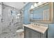 Bathroom with marble shower and vanity with marble top at 15653 W Monterey Way, Goodyear, AZ 85395