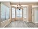 Bright dining area with bay windows and a chandelier at 15653 W Monterey Way, Goodyear, AZ 85395