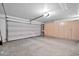 Garage with light-colored flooring and built-in storage cabinets at 15653 W Monterey Way, Goodyear, AZ 85395