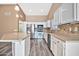 Modern kitchen with stainless steel appliances and an island at 15653 W Monterey Way, Goodyear, AZ 85395