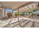 Relaxing patio area under a shaded pergola at 15653 W Monterey Way, Goodyear, AZ 85395