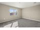 Bright bedroom with neutral walls and carpet flooring at 1587 S 239Th Dr, Buckeye, AZ 85326