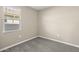 Simple bedroom with carpet flooring and a window with blinds at 1587 S 239Th Dr, Buckeye, AZ 85326