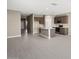 Open concept kitchen with island and stainless steel appliances at 1587 S 239Th Dr, Buckeye, AZ 85326