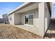 Covered patio with sliding glass doors, ideal for outdoor entertaining at 1587 S 239Th Dr, Buckeye, AZ 85326