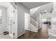 Entryway with tile floor, powder room, and stairs at 1649 N 212Th Dr, Buckeye, AZ 85396