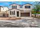 Two-story house with brown garage door and landscaping at 1649 N 212Th Dr, Buckeye, AZ 85396