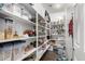 Well-organized pantry with ample shelving for storage at 1649 N 212Th Dr, Buckeye, AZ 85396