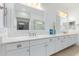 Bathroom with double vanity, quartz countertop and large mirror at 16611 S 9Th St, Phoenix, AZ 85048