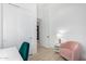 Spacious bedroom with a pink chair and built-in closet at 16611 S 9Th St, Phoenix, AZ 85048