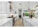 Open concept kitchen with white cabinets, quartz countertops and an island at 16611 S 9Th St, Phoenix, AZ 85048