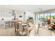 Modern kitchen with white cabinetry, quartz countertops, and an island with bar seating at 16611 S 9Th St, Phoenix, AZ 85048