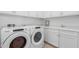 Laundry room with Whirlpool washer and dryer at 16611 S 9Th St, Phoenix, AZ 85048