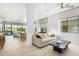 Open concept living area with white shiplap walls and a view of the backyard pool at 16611 S 9Th St, Phoenix, AZ 85048