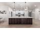 Large kitchen island with white cabinets and marble countertop at 16831 S 14Th Ln, Phoenix, AZ 85045