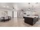 Open concept kitchen and dining area with modern island and breakfast bar at 16831 S 14Th Ln, Phoenix, AZ 85045