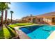 Inviting backyard oasis featuring a sparkling pool and patio area at 16831 S 14Th Ln, Phoenix, AZ 85045