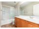 Bathroom with single sink vanity and shower/tub combo at 1749 W Desert Mountain Dr, San Tan Valley, AZ 85144