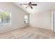 Spacious bedroom with ceiling fan and carpet flooring at 1749 W Desert Mountain Dr, San Tan Valley, AZ 85144