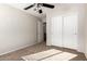 Bright bedroom with double door closet and carpet flooring at 1749 W Desert Mountain Dr, San Tan Valley, AZ 85144