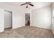 Bright bedroom with ceiling fan and carpet flooring at 1749 W Desert Mountain Dr, San Tan Valley, AZ 85144