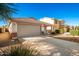 House exterior with gray garage door and driveway at 1749 W Desert Mountain Dr, San Tan Valley, AZ 85144